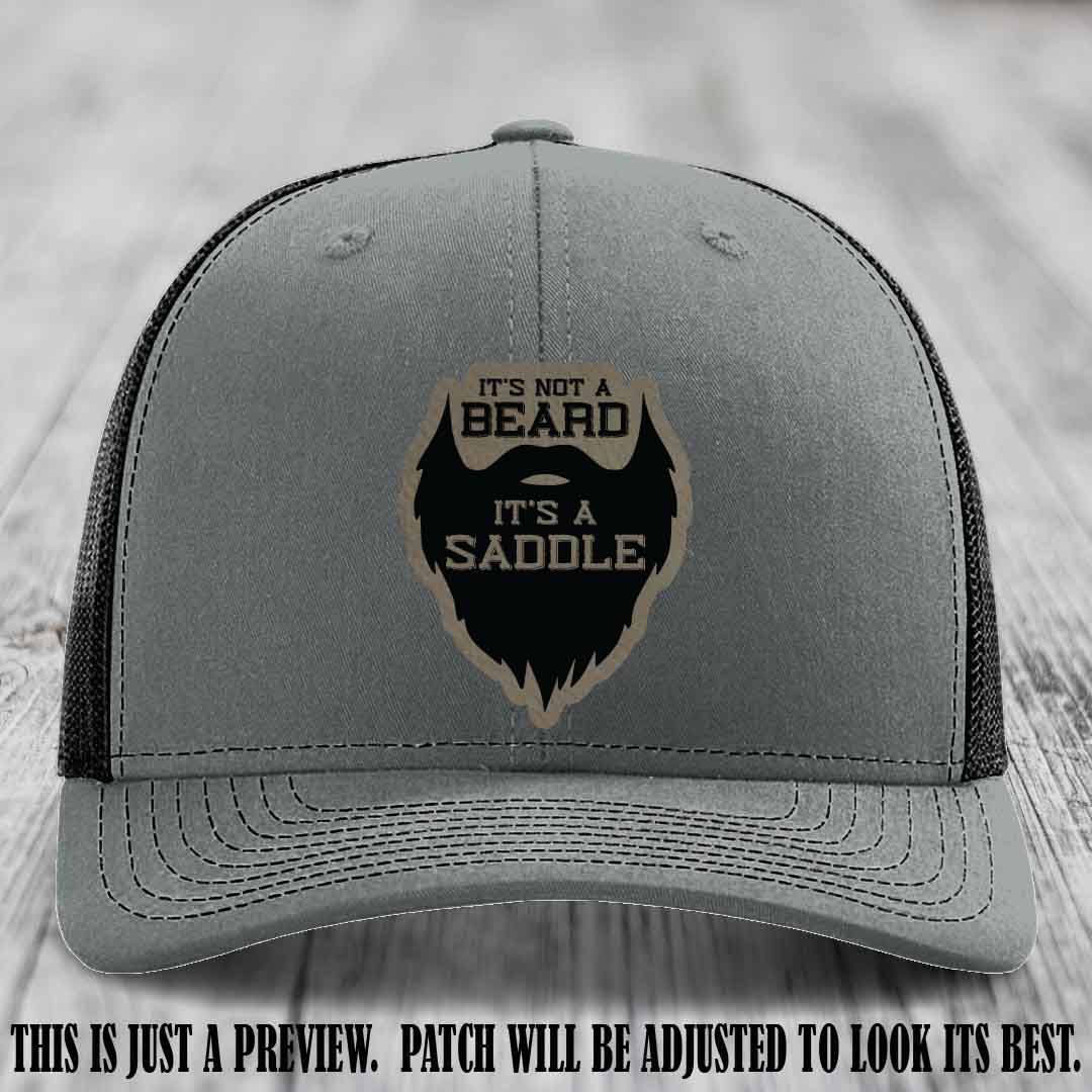 Beard Saddle design on a Light Brown to Black Patch, Richardson 112 leather patch hat on a Heather Grey to Black Hat