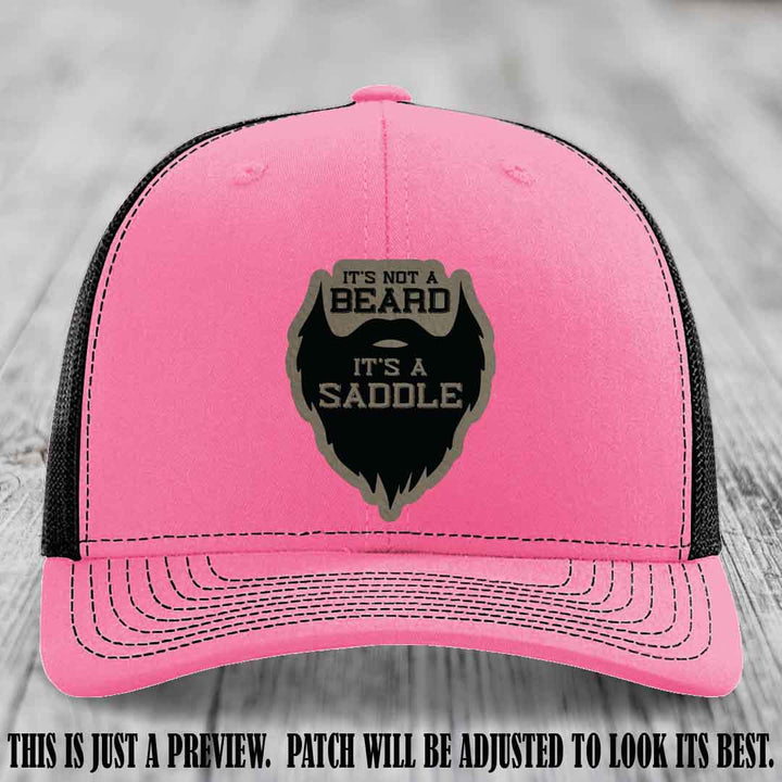 Beard Saddle design on a Light Brown to Black Patch, Richardson 112 leather patch hat on a Hot Pink to Black Hat