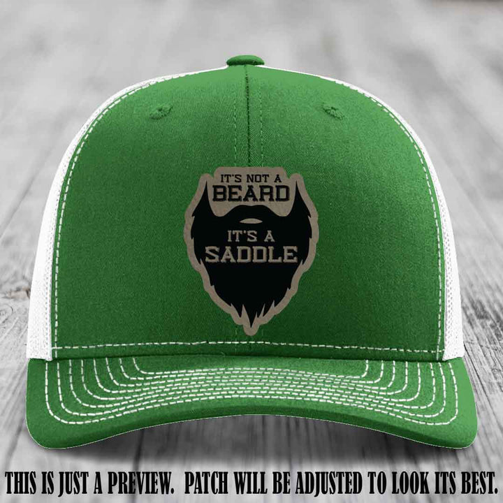 Beard Saddle design on a Light Brown to Black Patch, Richardson 112 leather patch hat on a Kelly to White Hat