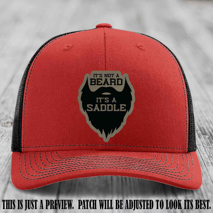 Beard Saddle design on a Light Brown to Black Patch, Richardson 112 leather patch hat on a Red to Black Hat