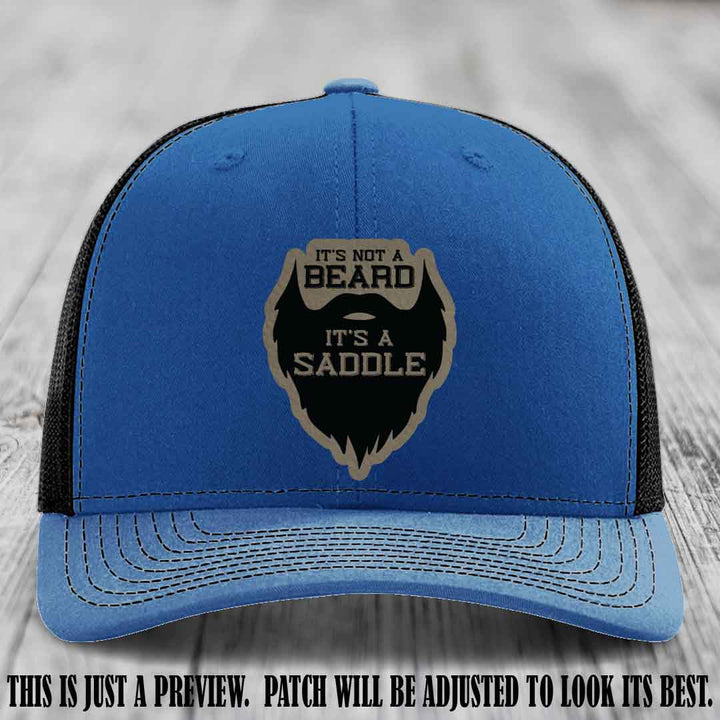 Beard Saddle design on a Light Brown to Black Patch, Richardson 112 leather patch hat on a Royal to Black Hat