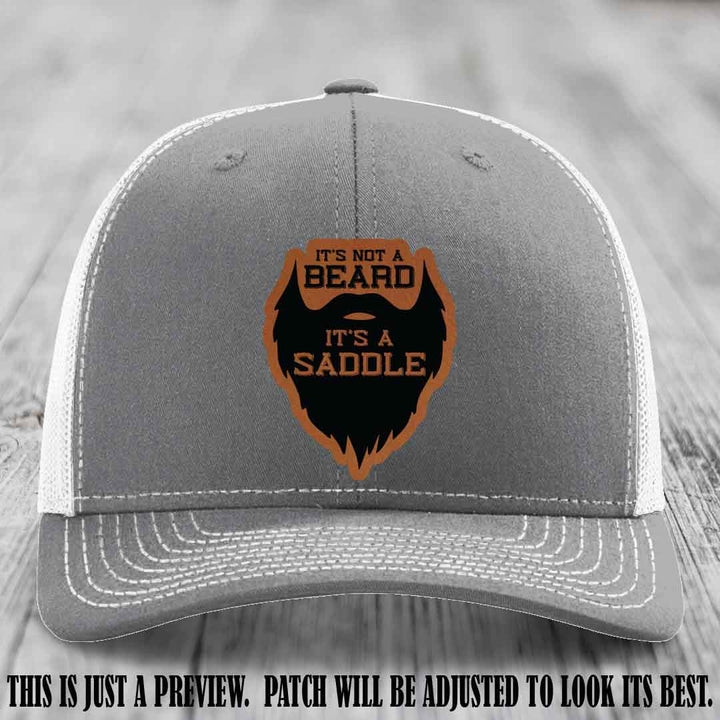 Beard Saddle design on a Rawhide to Black Patch, Richardson 112 leather patch hat on a Heather Grey to White Hat