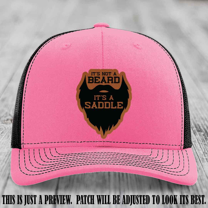 Beard Saddle design on a Rawhide to Black Patch, Richardson 112 leather patch hat on a Hot Pink to Black Hat