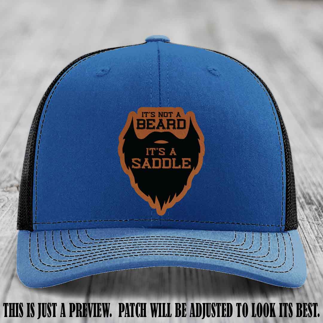 Beard Saddle design on a Rawhide to Black Patch, Richardson 112 leather patch hat on a Royal to Black Hat