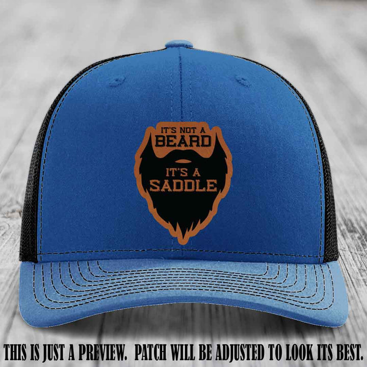 Beard Saddle design on a Rawhide to Black Patch, Richardson 112 leather patch hat on a Royal to Black Hat