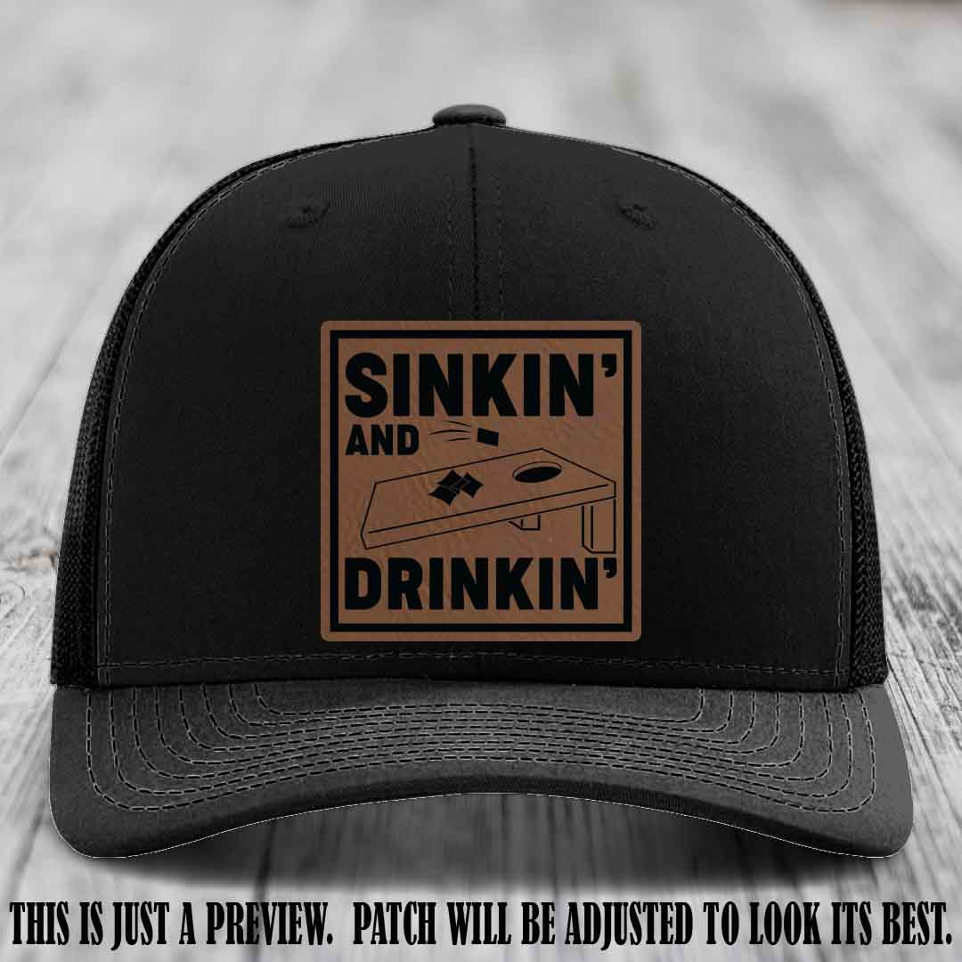 Sinkin' and Drinkin' design on Dark Brown to Black Patch, Richardson 112 Black Hat