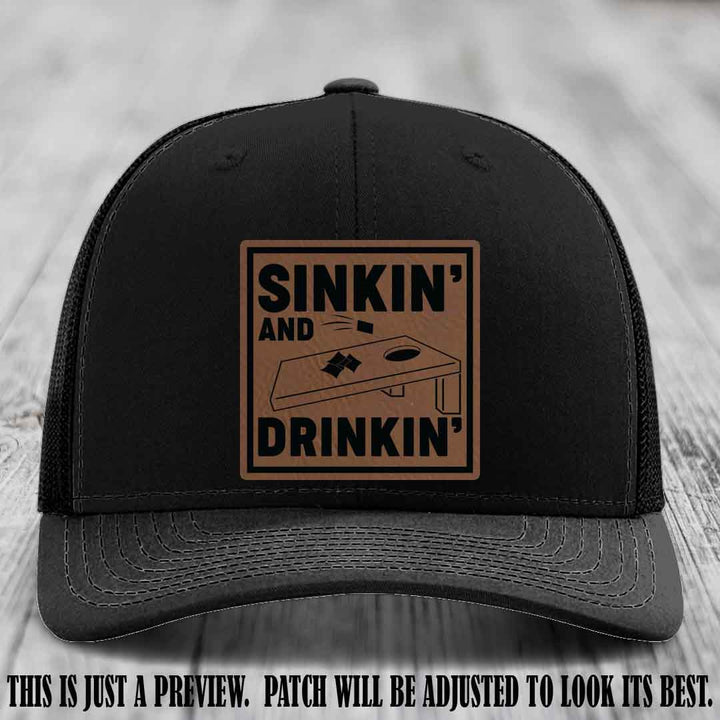 Sinkin' and Drinkin' design on Dark Brown to Black Patch, Richardson 112 Black Hat