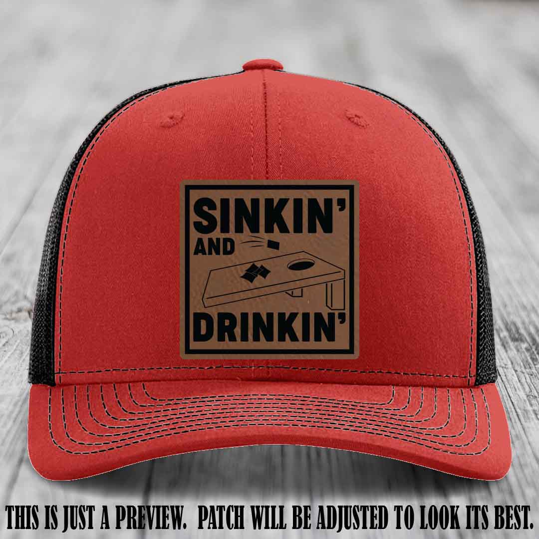 Sinkin' and Drinkin' design on Dark Brown to Black Patch, Richardson 112 Red to Black Hat