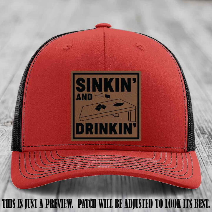 Sinkin' and Drinkin' design on Dark Brown to Black Patch, Richardson 112 Red to Black Hat