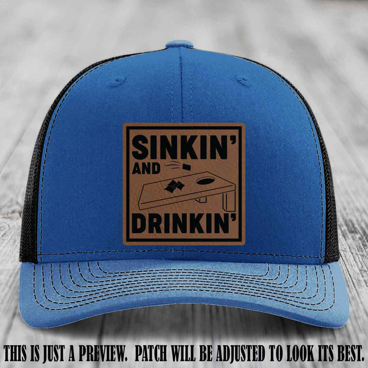 Sinkin' and Drinkin' design on Dark Brown to Black Patch, Richardson 112 Royal to Black Hat