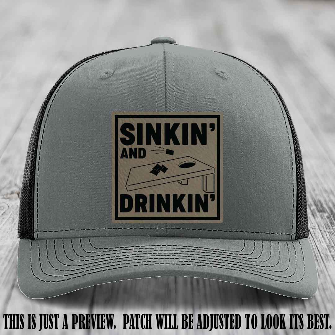 Sinkin' and Drinkin' design on Light Brown to Black Patch, Richardson 112 Heather Grey to Black Hat