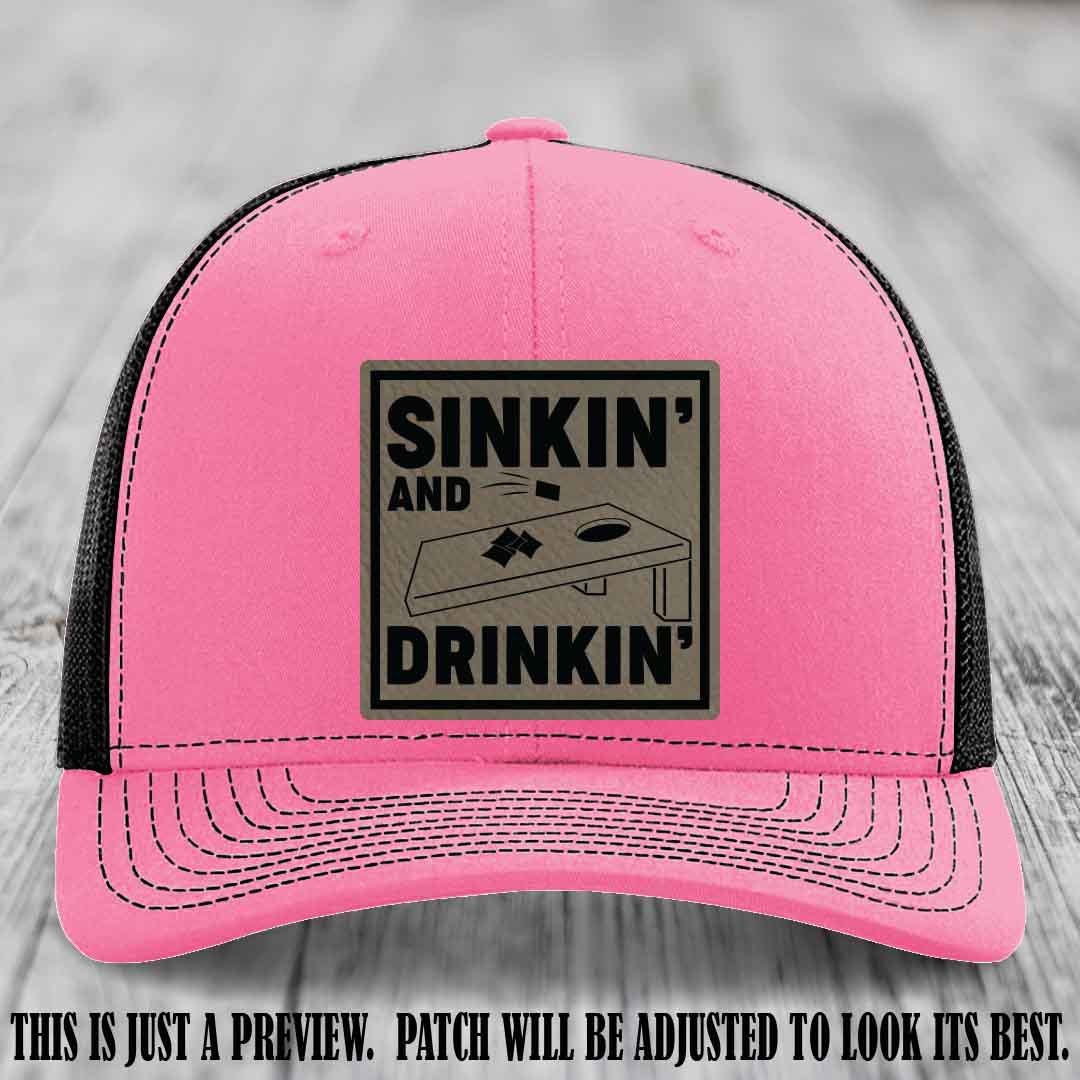 Sinkin' and Drinkin' design on Light Brown to Black Patch, Richardson 112 Hot Pink to Black Hat