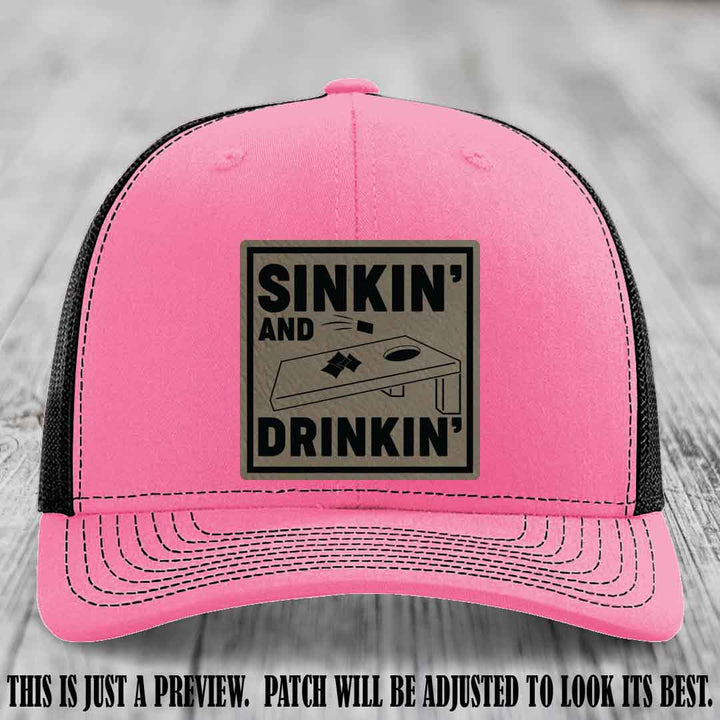 Sinkin' and Drinkin' design on Light Brown to Black Patch, Richardson 112 Hot Pink to Black Hat
