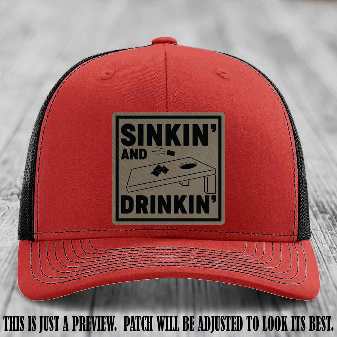 Sinkin' and Drinkin' design on Light Brown to Black Patch, Richardson 112 Red to Black Hat