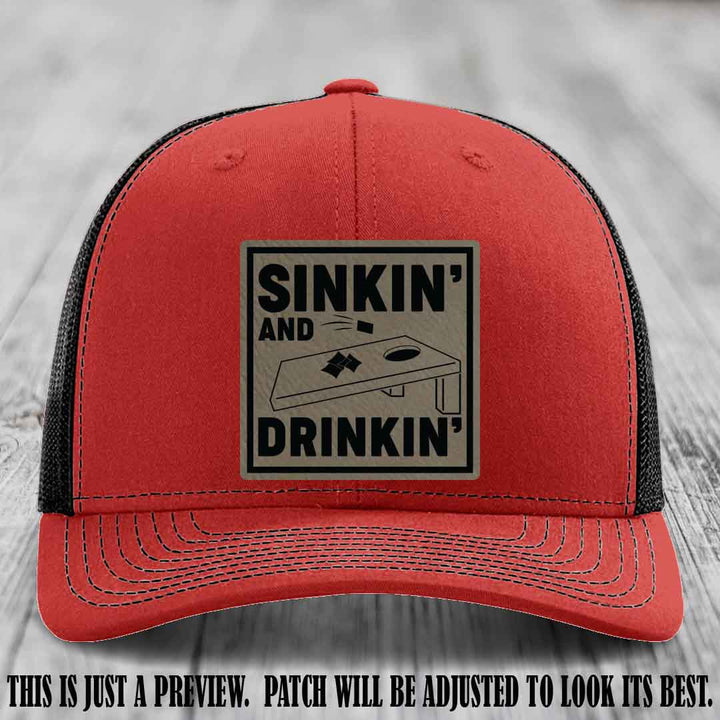 Sinkin' and Drinkin' design on Light Brown to Black Patch, Richardson 112 Red to Black Hat