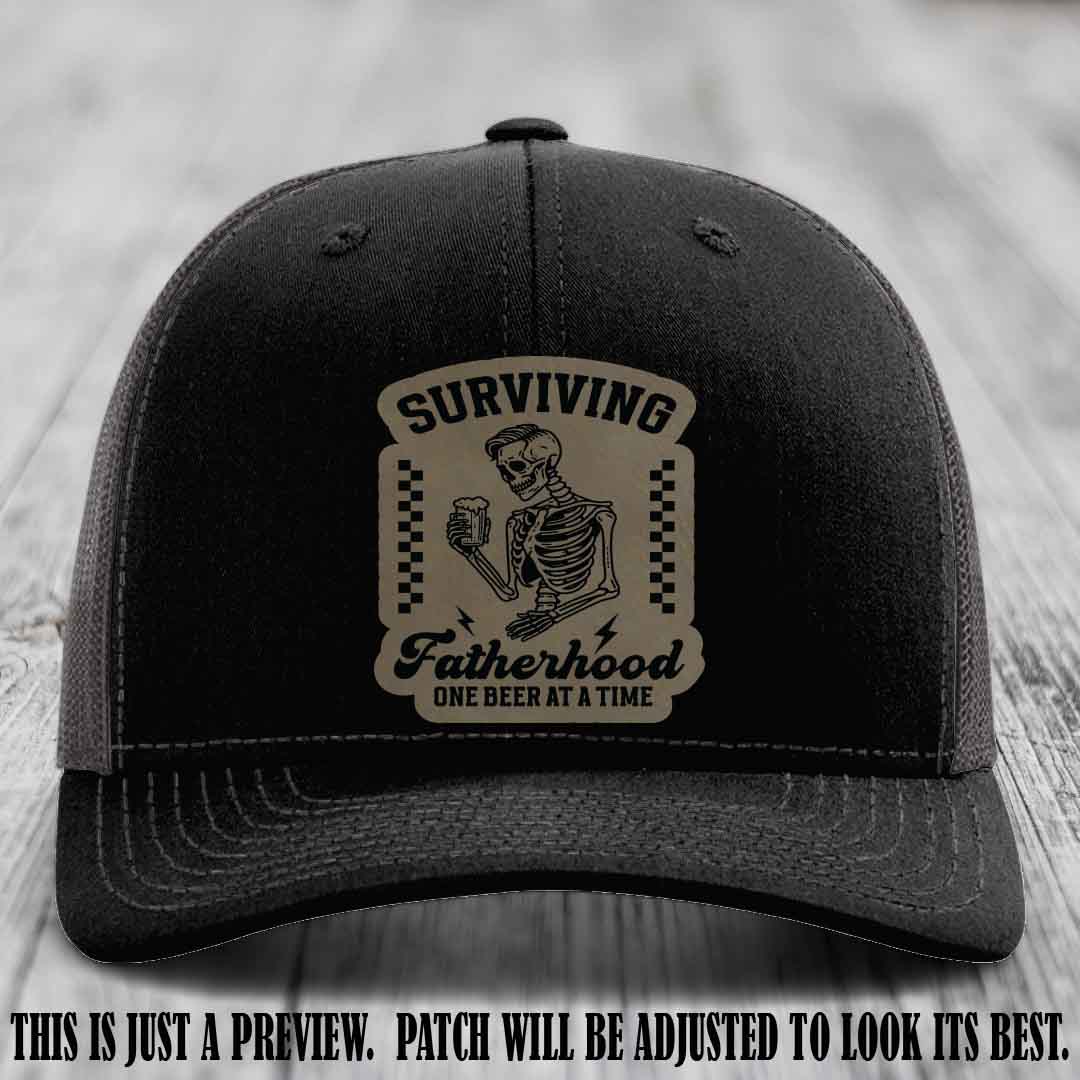 Surviving Fatherhood - Light Brown to Black Patch on Black to Charcoal Hat, funny dad hat