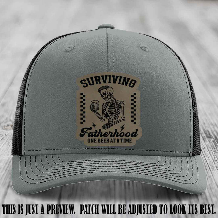Surviving Fatherhood - Light Brown to Black Patch on Heather Grey to Black Hat, funny dad hat