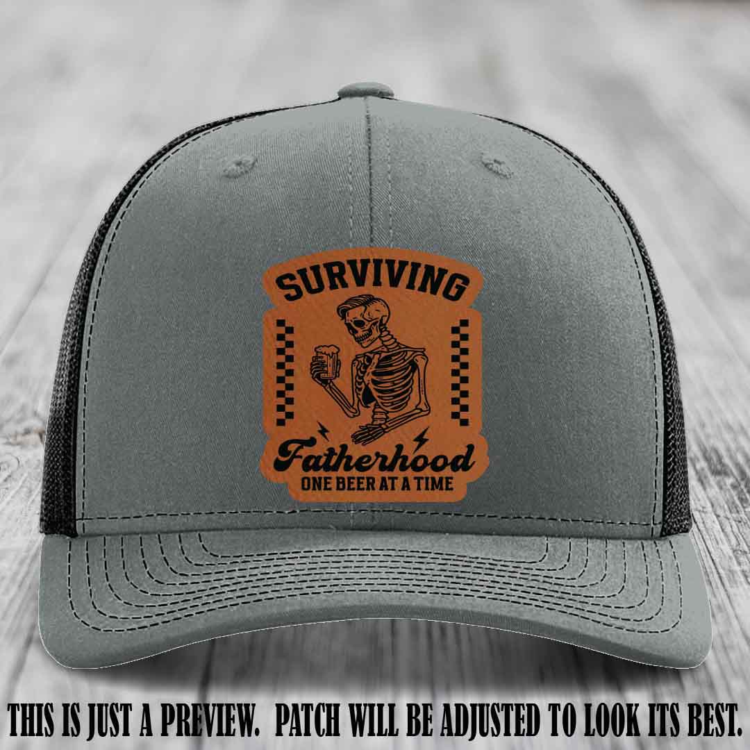 Surviving Fatherhood - Rawhide to Black Patch on Heather Grey to Black Hat, funny dad hat