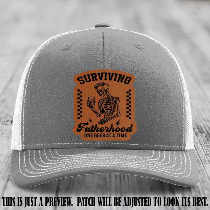 Surviving Fatherhood - Rawhide to Black Patch on Heather Grey to White Hat, funny dad hat