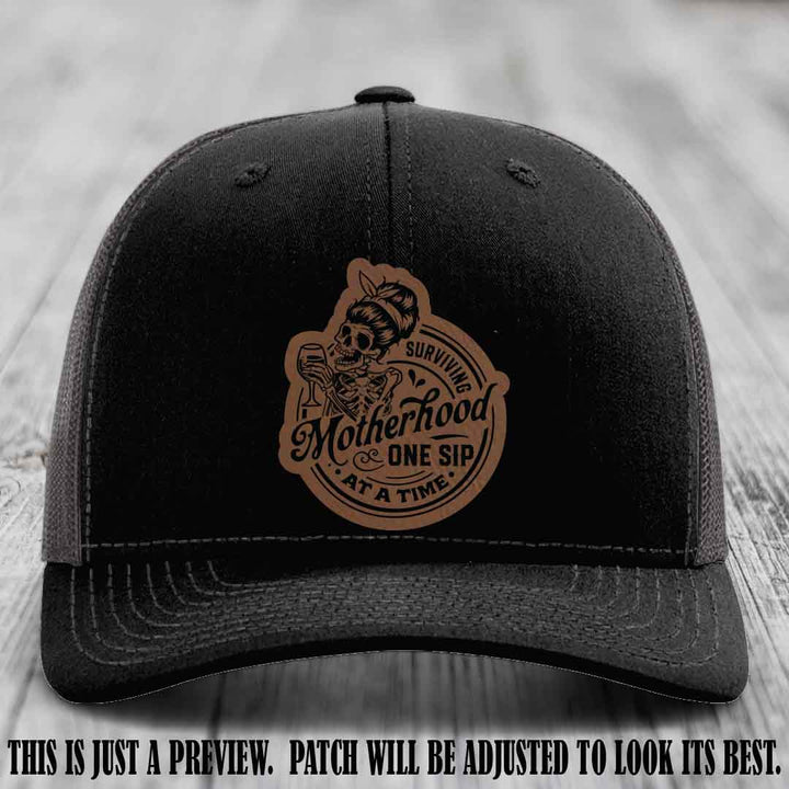 Surviving Motherhood One Sip at a Time Dark Brown to Black Patch on Richardson 112 Hat - Black to Charcoal Hat