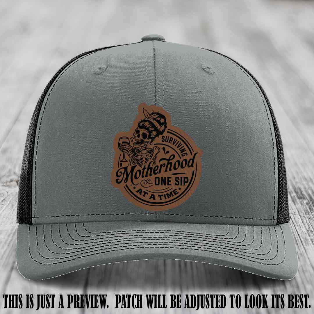 Surviving Motherhood One Sip at a Time Dark Brown to Black Patch on Richardson 112 Hat - Heather Grey to Black Hat