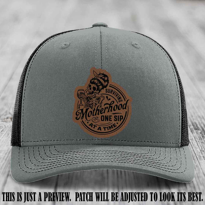 Surviving Motherhood One Sip at a Time Dark Brown to Black Patch on Richardson 112 Hat - Heather Grey to Black Hat