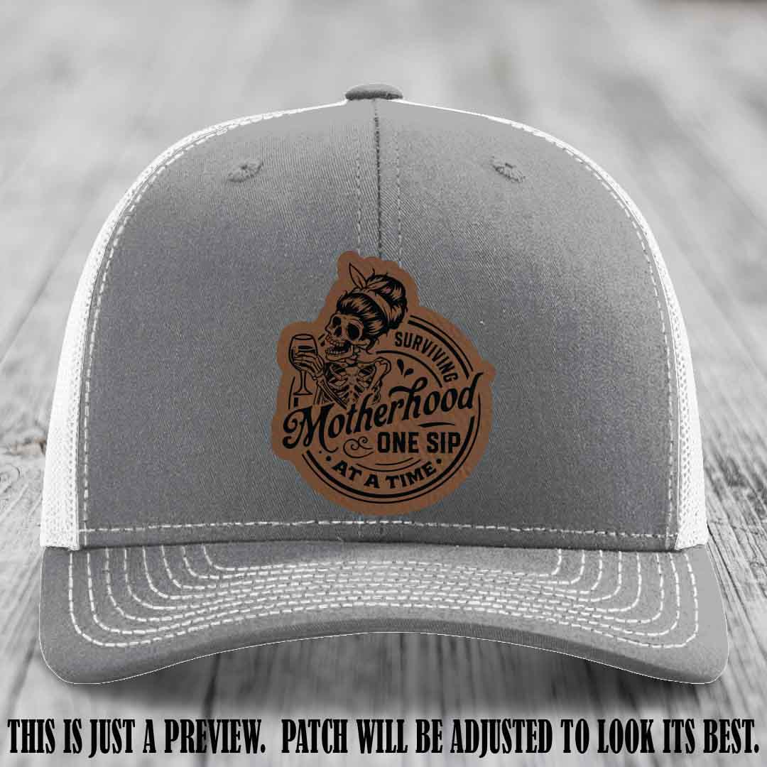 Surviving Motherhood One Sip at a Time Dark Brown to Black Patch on Richardson 112 Hat - Heather Grey to White Hat
