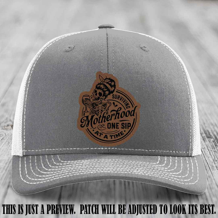 Surviving Motherhood One Sip at a Time Dark Brown to Black Patch on Richardson 112 Hat - Heather Grey to White Hat
