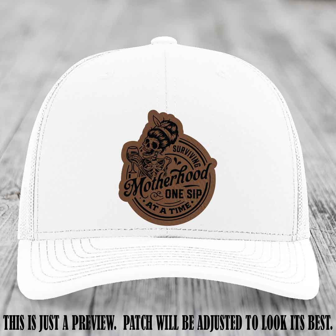 Surviving Motherhood One Sip at a Time Dark Brown to Black Patch on Richardson 112 Hat - White Hat