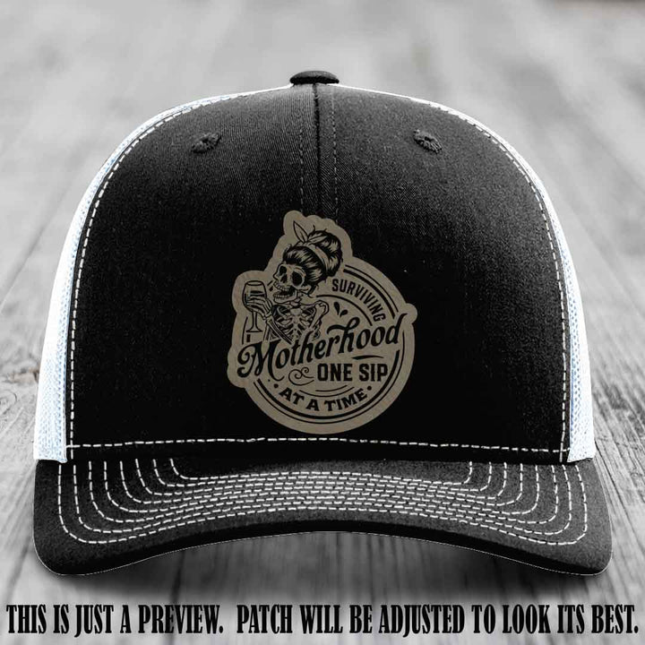 Surviving Motherhood One Sip at a Time Light Brown to Black Patch on Richardson 112 Hat - Black to White Hat