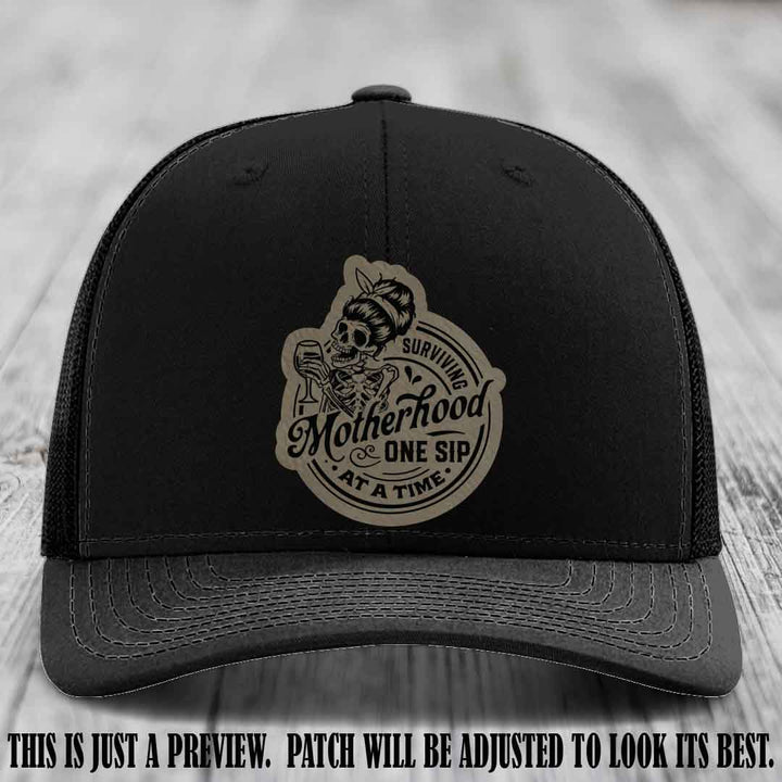 Surviving Motherhood One Sip at a Time Light Brown to Black Patch on Richardson 112 Hat - Black Hat