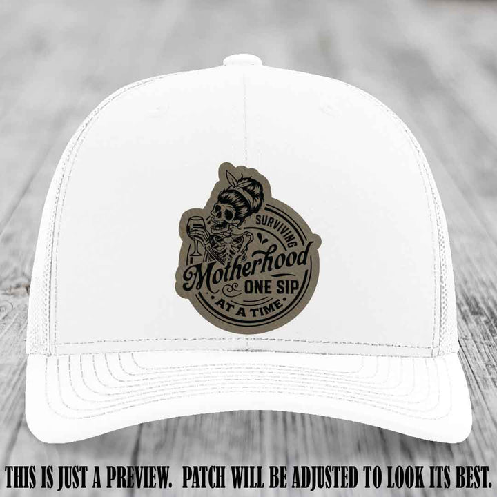 Surviving Motherhood One Sip at a Time Light Brown to Black Patch on Richardson 112 Hat - White Hat