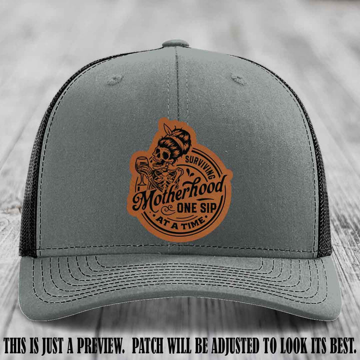 Surviving Motherhood One Sip at a Time Rawhide to Black Patch on Richardson 112 Hat - Heather Grey to Black Hat