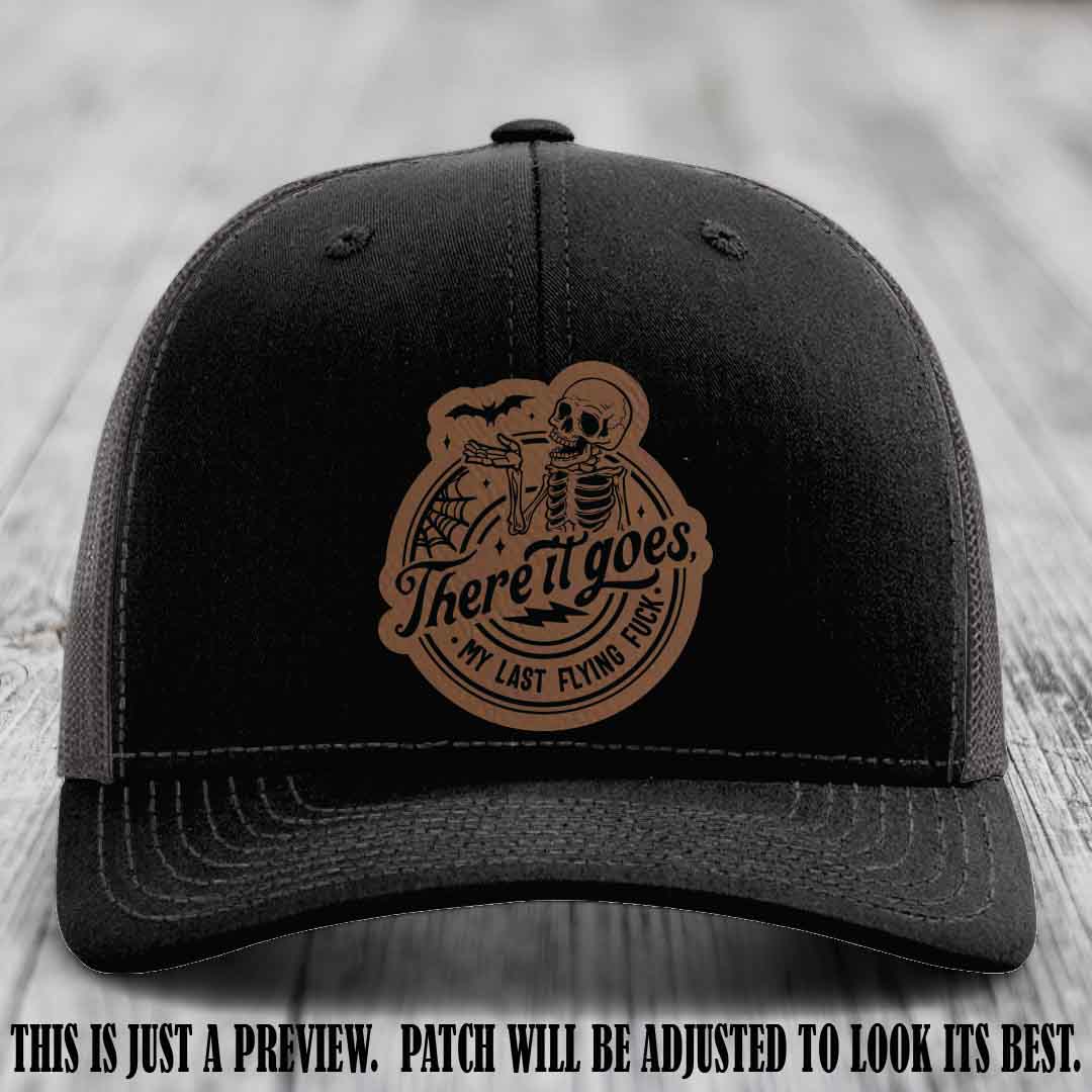 There It Goes design on Dark Brown to Black Patch, displayed on a Black to Charcoal Hat, funny Richardson 112 leather patch hat