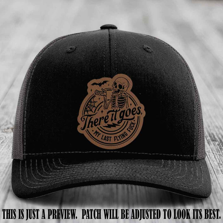 There It Goes design on Dark Brown to Black Patch, displayed on a Black to Charcoal Hat, funny Richardson 112 leather patch hat