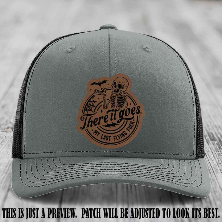 There It Goes design on Dark Brown to Black Patch, displayed on a Heather Grey to Black Hat, funny Richardson 112 leather patch hat