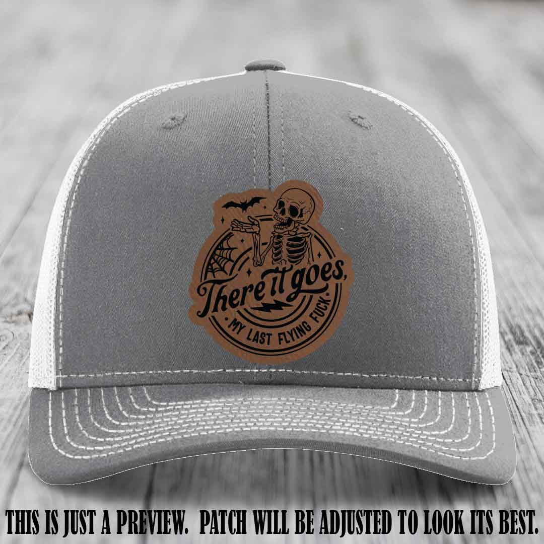 There It Goes design on Dark Brown to Black Patch, displayed on a Heather Grey to White Hat, funny Richardson 112 leather patch hat