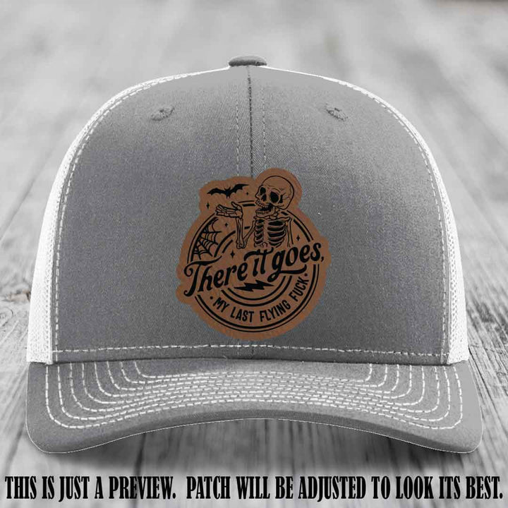 There It Goes design on Dark Brown to Black Patch, displayed on a Heather Grey to White Hat, funny Richardson 112 leather patch hat