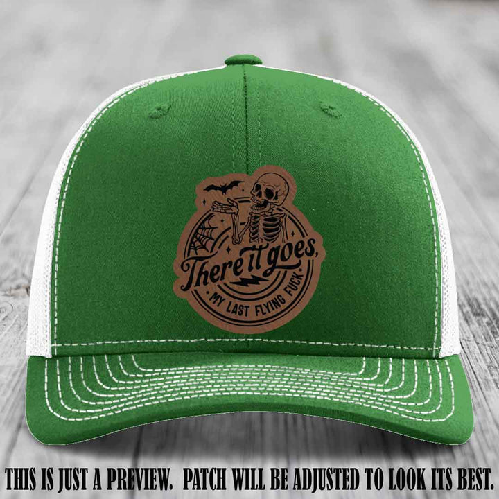 There It Goes design on Dark Brown to Black Patch, displayed on a Kelly to White Hat, funny Richardson 112 leather patch hat