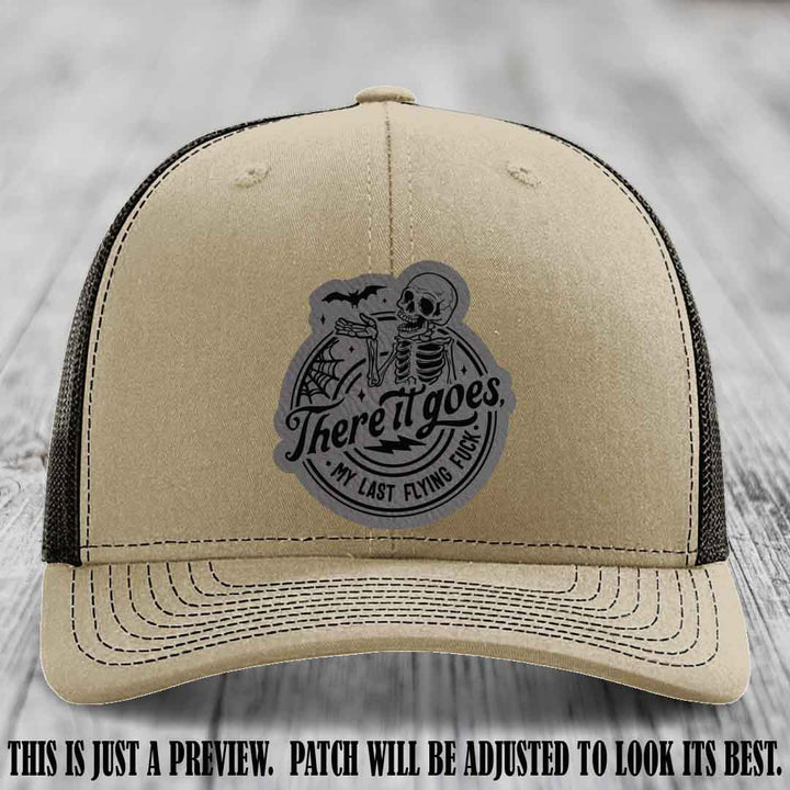There It Goes design on Grey to Black Patch, displayed on a Khaki to Coffee Hat, funny Richardson 112 leather patch hat