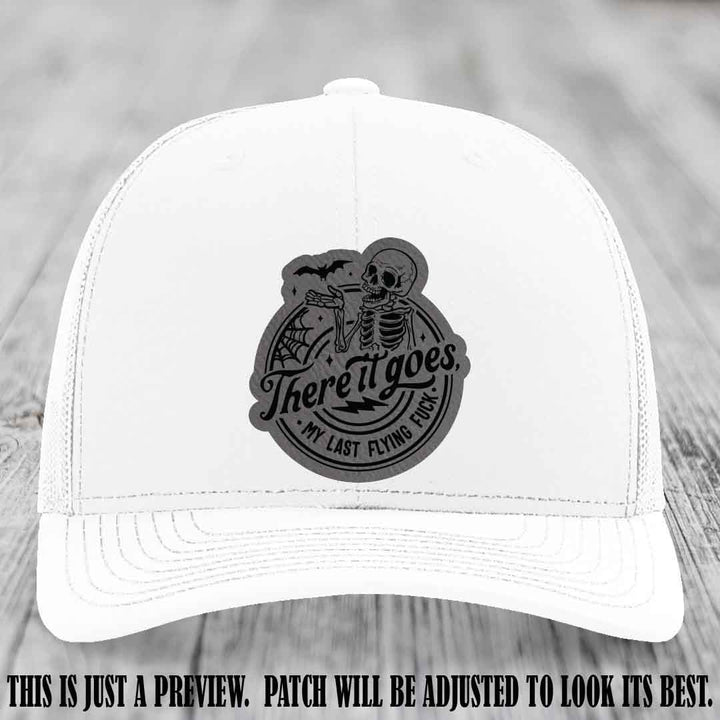 There It Goes design on Grey to Black Patch, displayed on a White Hat, funny Richardson 112 leather patch hat
