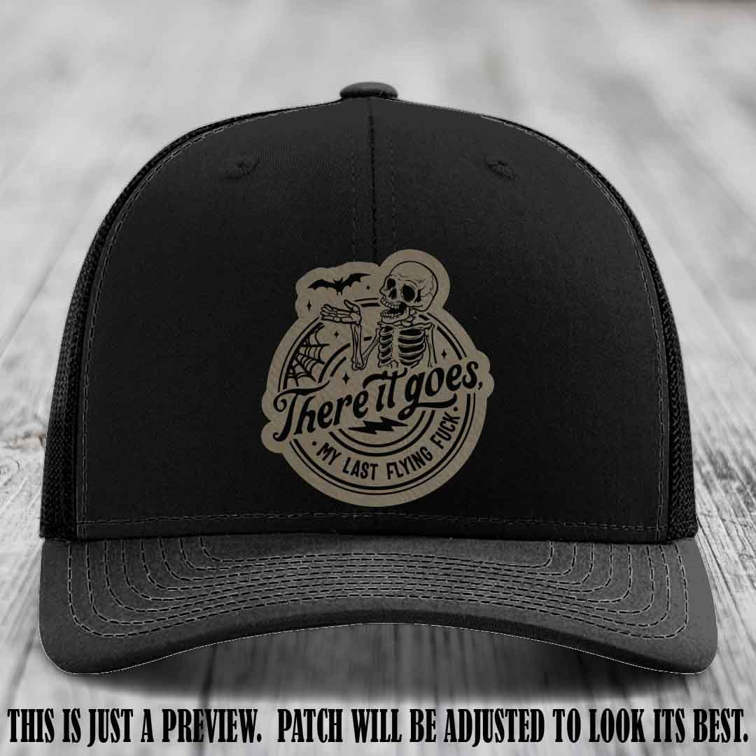 There It Goes design on Light Brown to Black Patch, displayed on a Black Hat, funny Richardson 112 leather patch hat