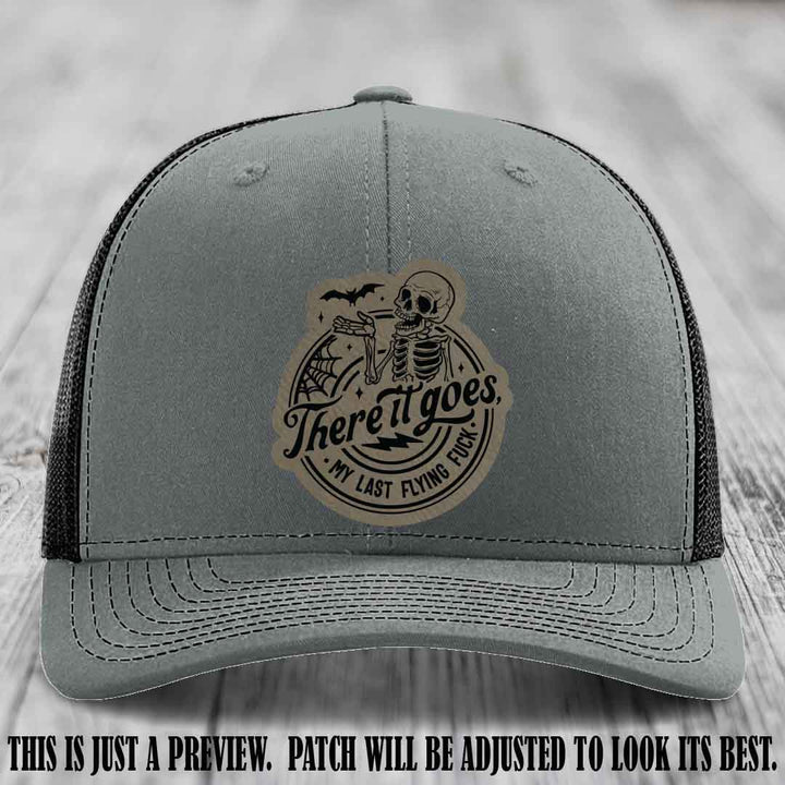 There It Goes design on Light Brown to Black Patch, displayed on a Heather Grey to Black Hat, funny Richardson 112 leather patch hat
