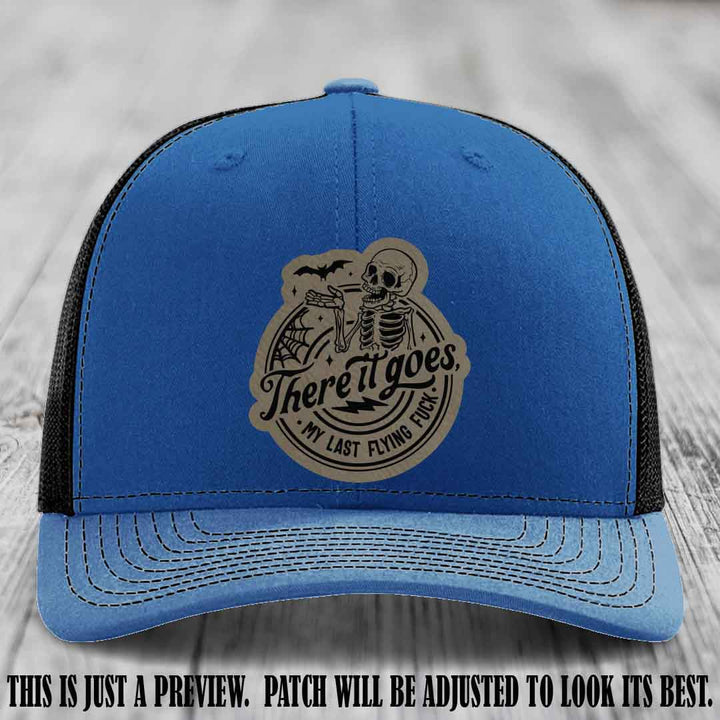 There It Goes design on Light Brown to Black Patch, displayed on a Royal to Black Hat, funny Richardson 112 leather patch hat