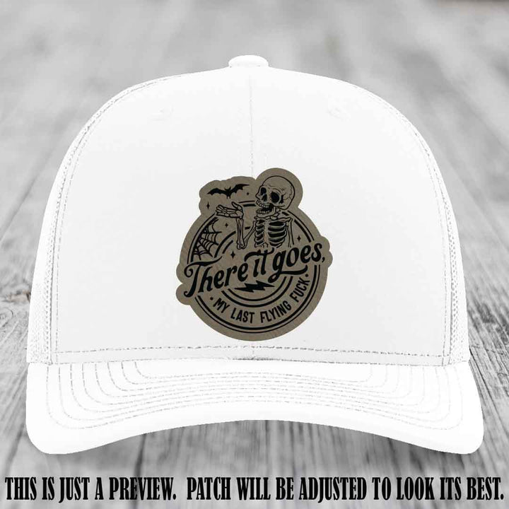 There It Goes design on Light Brown to Black Patch, displayed on a White Hat, funny Richardson 112 leather patch hat