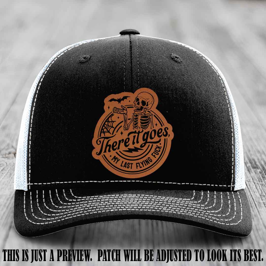 There It Goes design on Rawhide to Black Patch, displayed on a Black to White Hat, funny Richardson 112 leather patch hat