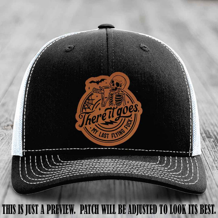 There It Goes design on Rawhide to Black Patch, displayed on a Black to White Hat, funny Richardson 112 leather patch hat
