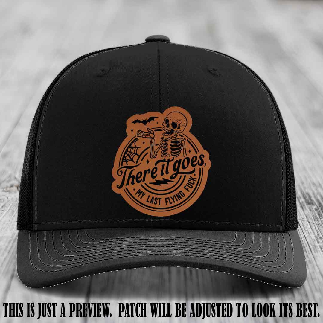 There It Goes design on Rawhide to Black Patch, displayed on a Black Hat, funny Richardson 112 leather patch hat