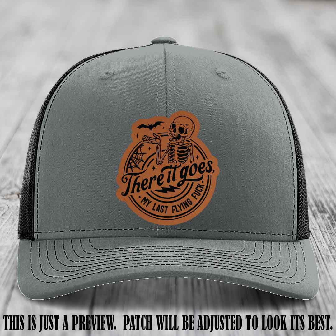 There It Goes design on Rawhide to Black Patch, displayed on a Heather Grey to Black Hat, funny Richardson 112 leather patch hat