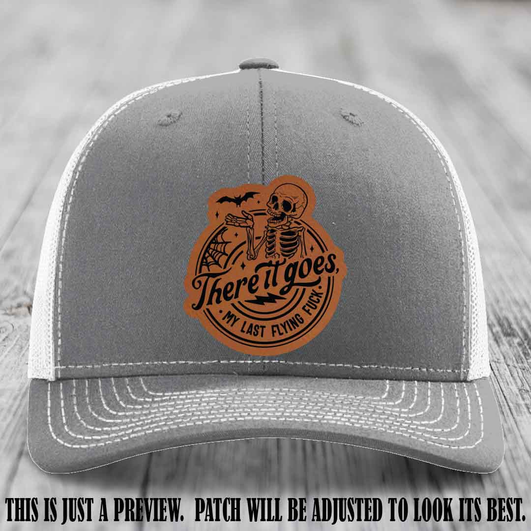 There It Goes design on Rawhide to Black Patch, displayed on a Heather Grey to White Hat, funny Richardson 112 leather patch hat